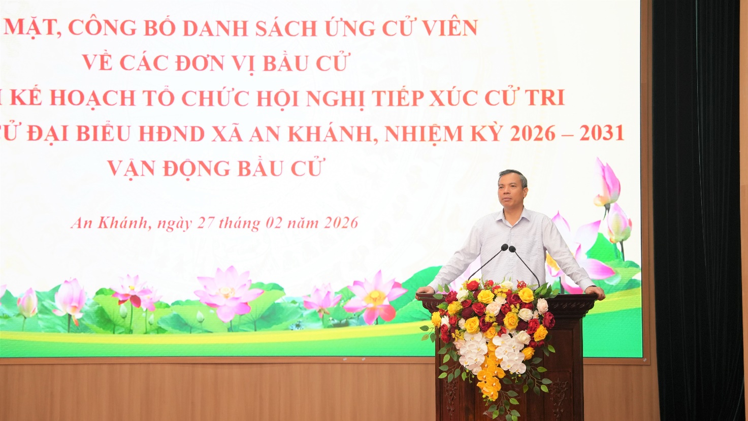 A person standing at a podium with flowers on it  AI-generated content may be incorrect.