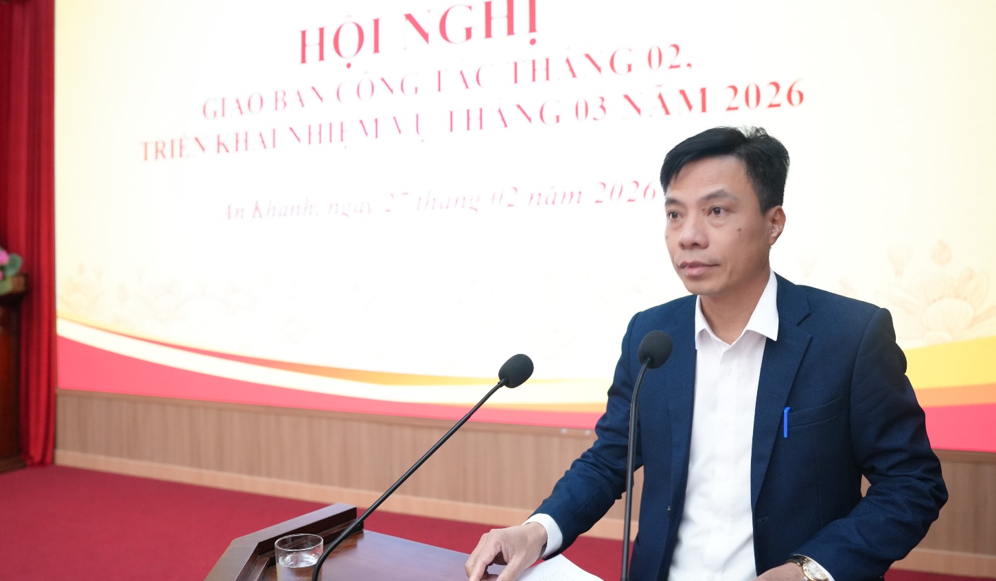 A person standing at a podium with microphones  AI-generated content may be incorrect.