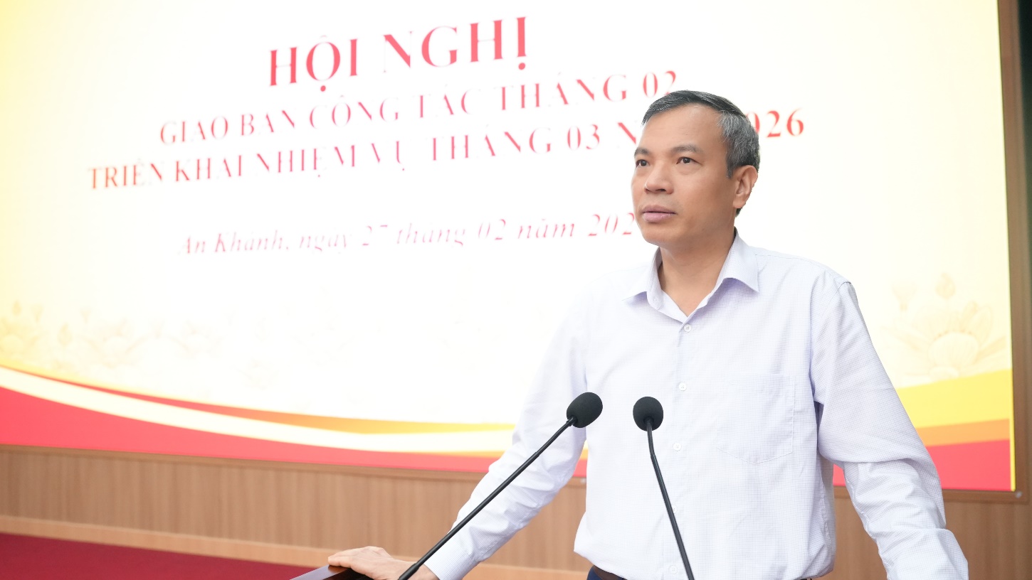 A person standing at a podium with microphones  AI-generated content may be incorrect.