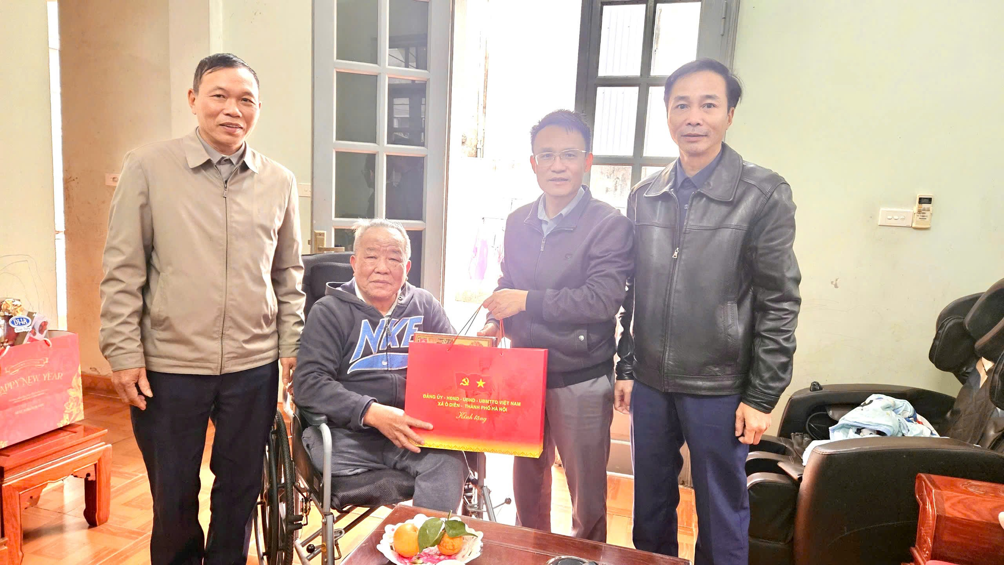 A group of men standing in a room  Description automatically generated