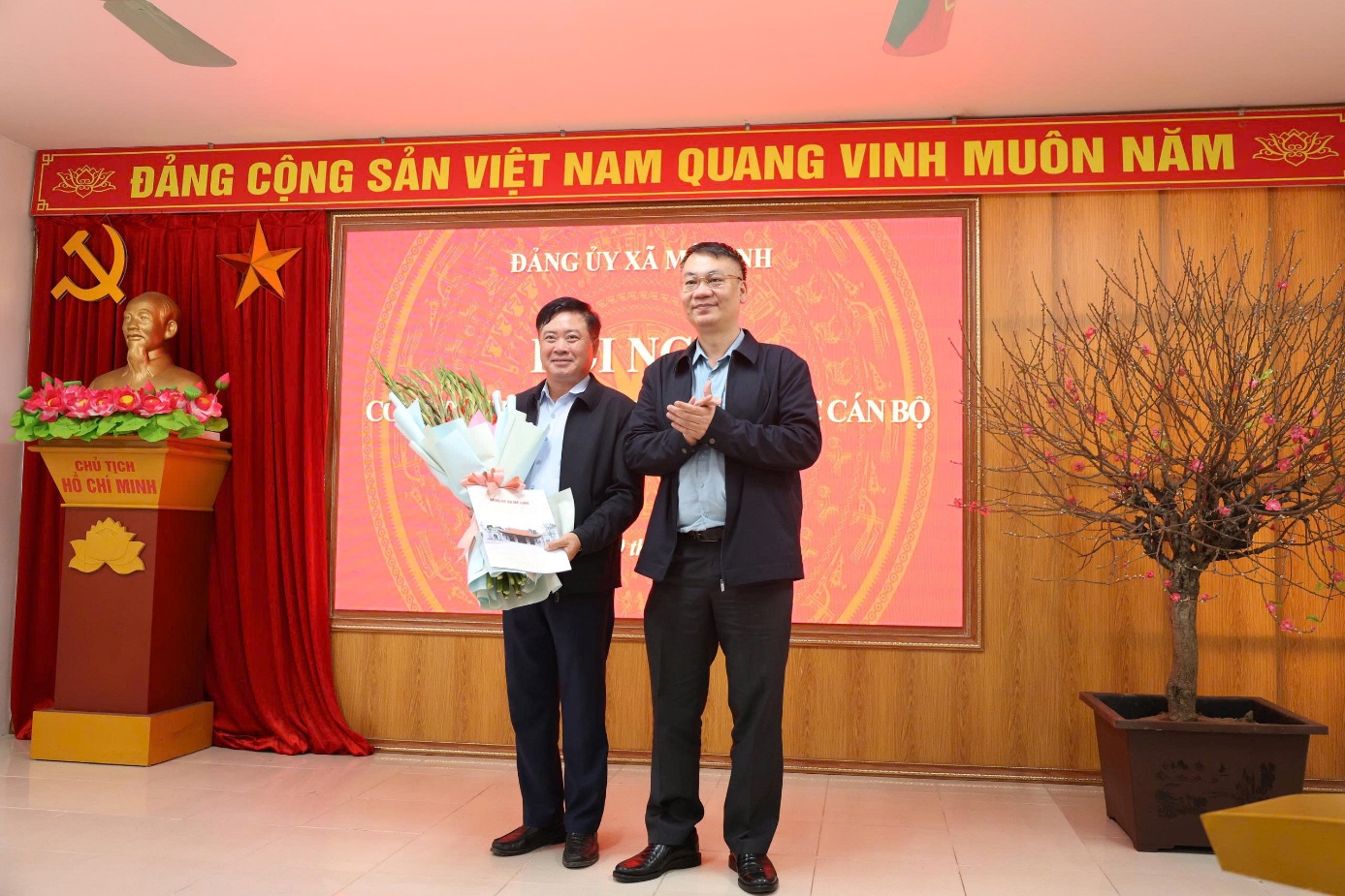 A person standing next to another person holding flowers  AI-generated content may be incorrect.