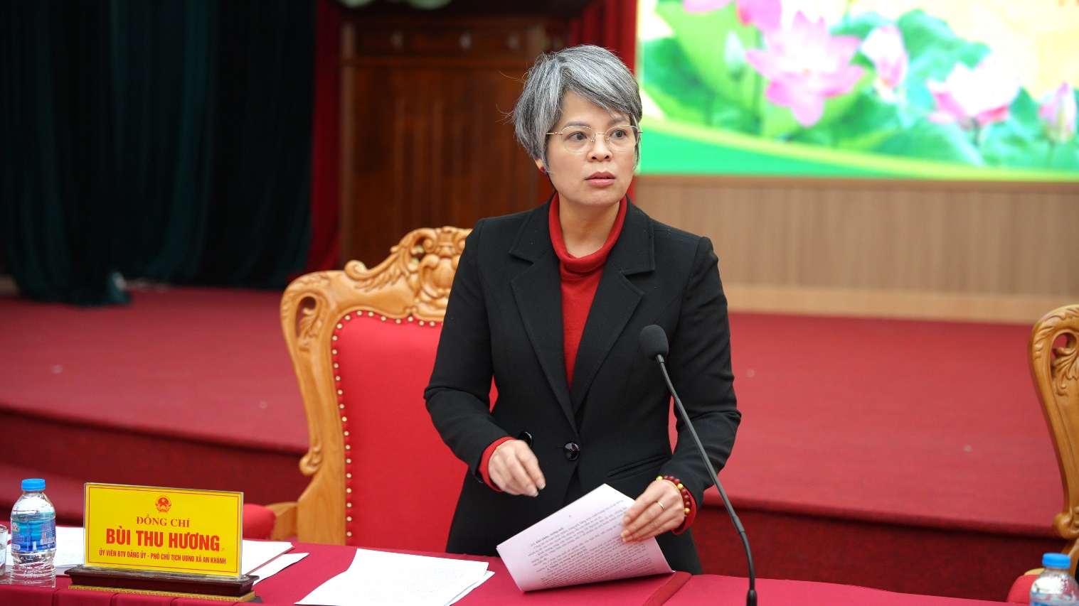 A person in a suit sitting at a table with a microphone  AI-generated content may be incorrect.