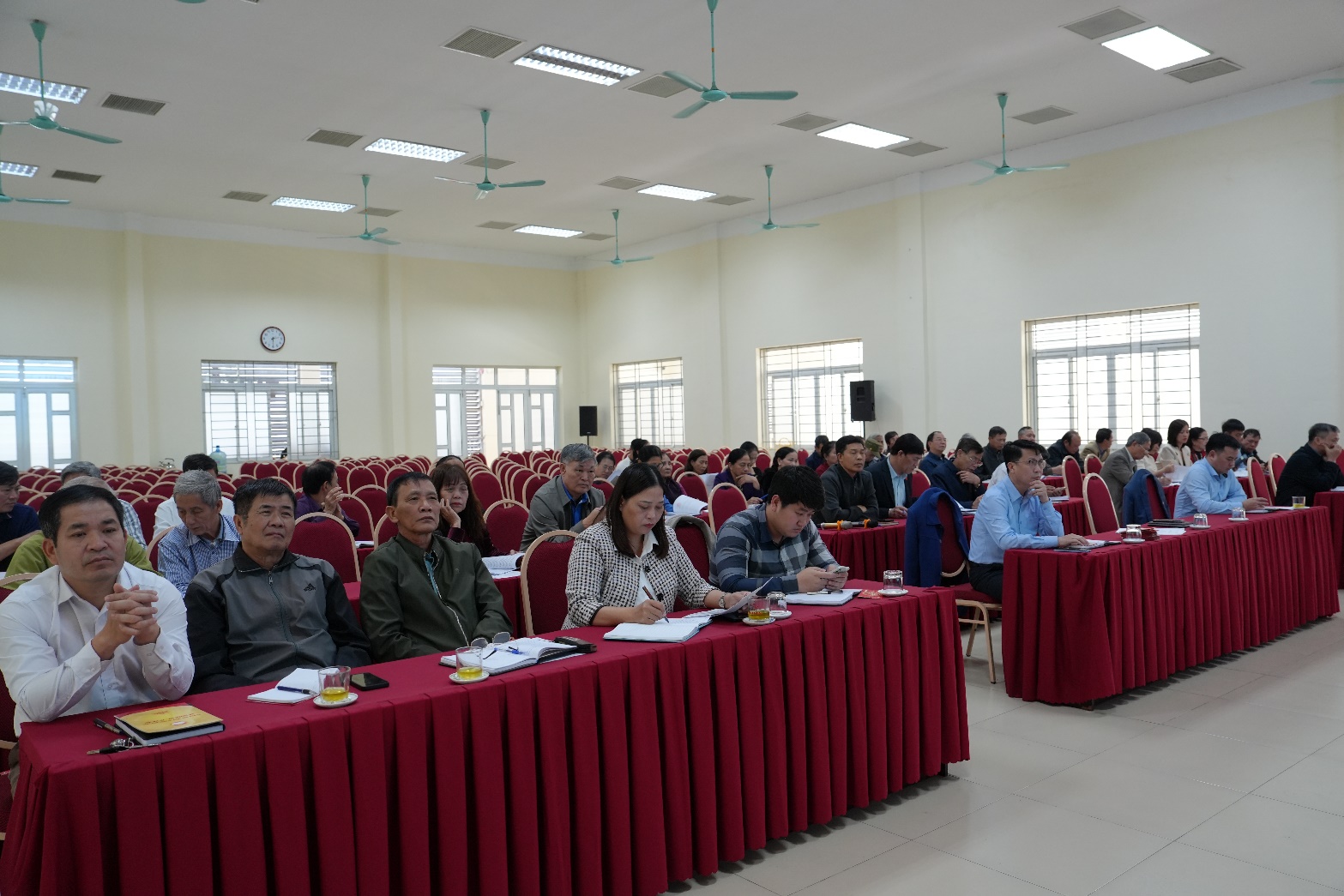 A group of people sitting at a table  AI-generated content may be incorrect.