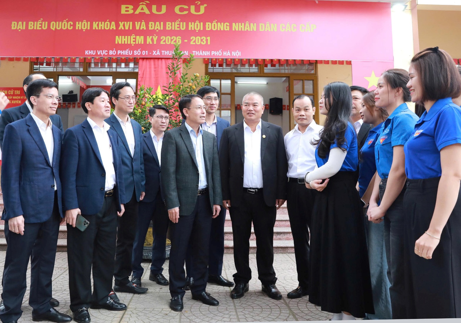 A group of people standing outside a building  AI-generated content may be incorrect.