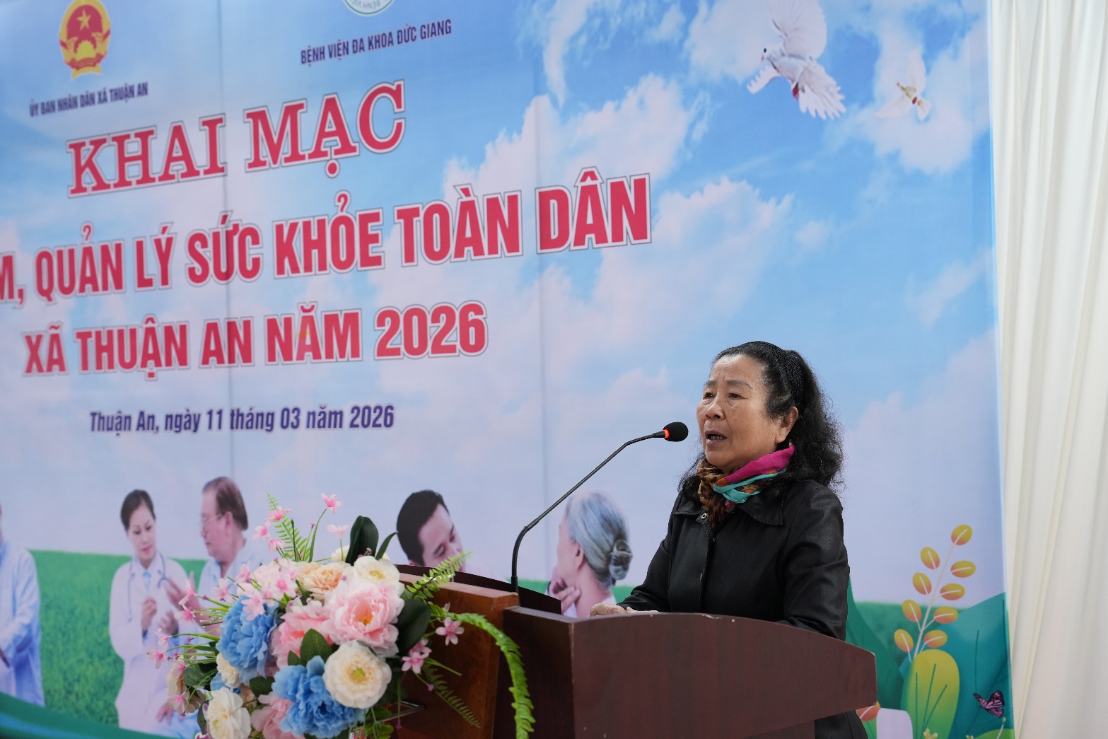 A person speaking at a podium  AI-generated content may be incorrect.