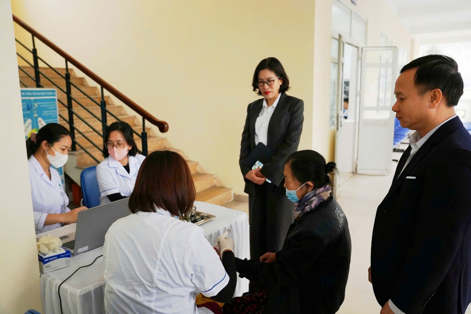A group of people standing in a hallway  AI-generated content may be incorrect.