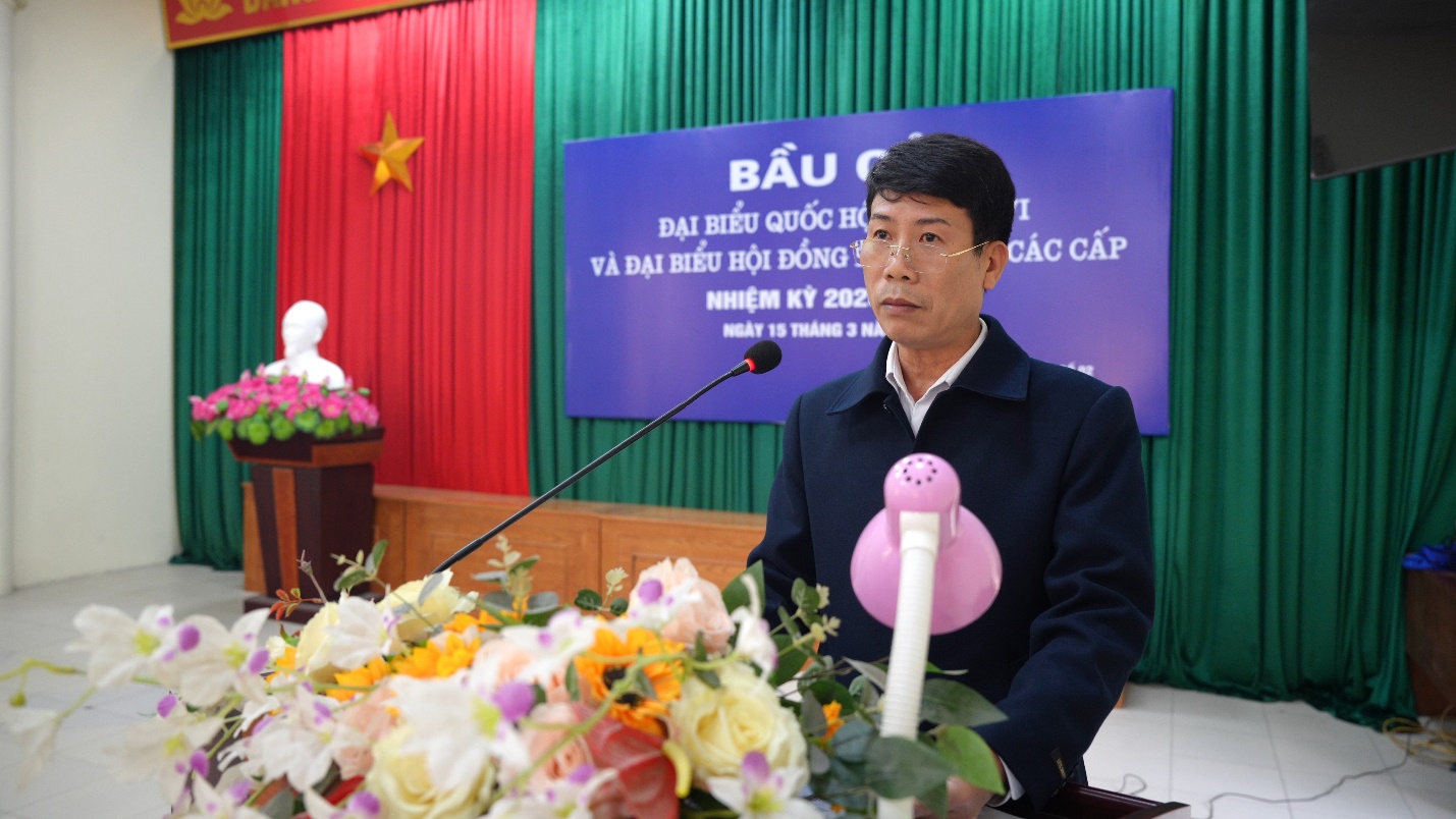 A person standing at a podium with a microphone  AI-generated content may be incorrect.