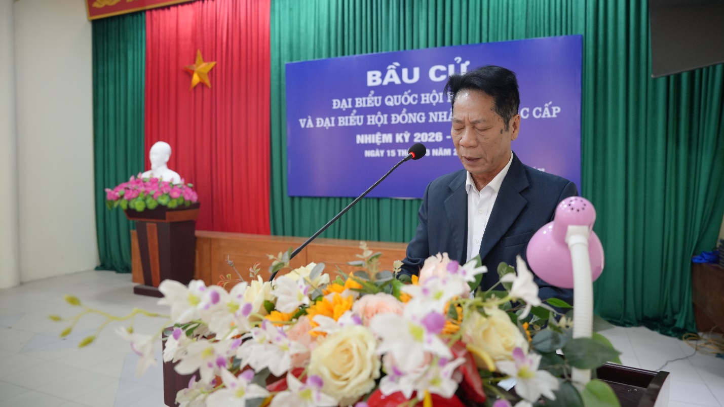 A person standing at a podium with a microphone  AI-generated content may be incorrect.