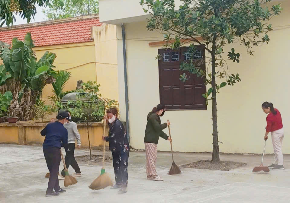 A group of people sweeping the street  AI-generated content may be incorrect.