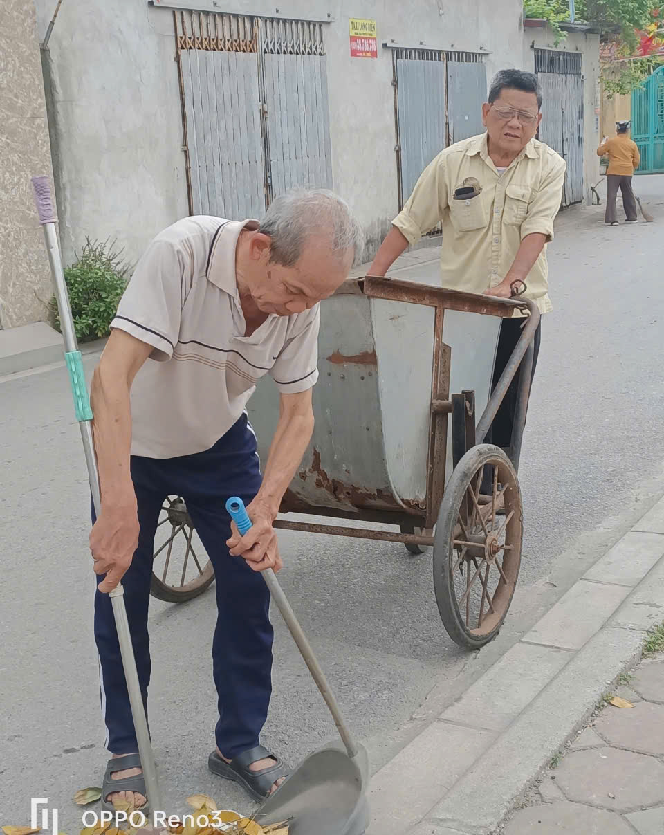 A person cleaning the sidewalk with a wheelbarrow  AI-generated content may be incorrect.
