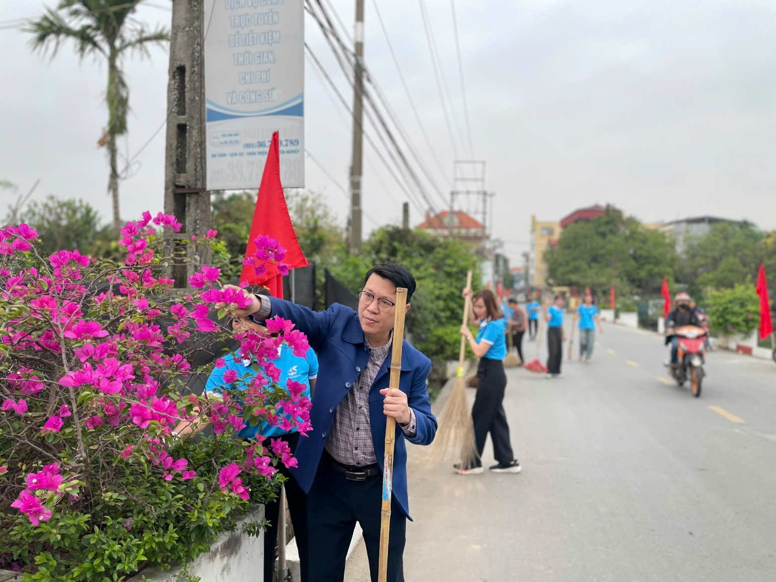 A person holding a shovel and pointing at flowers  AI-generated content may be incorrect.