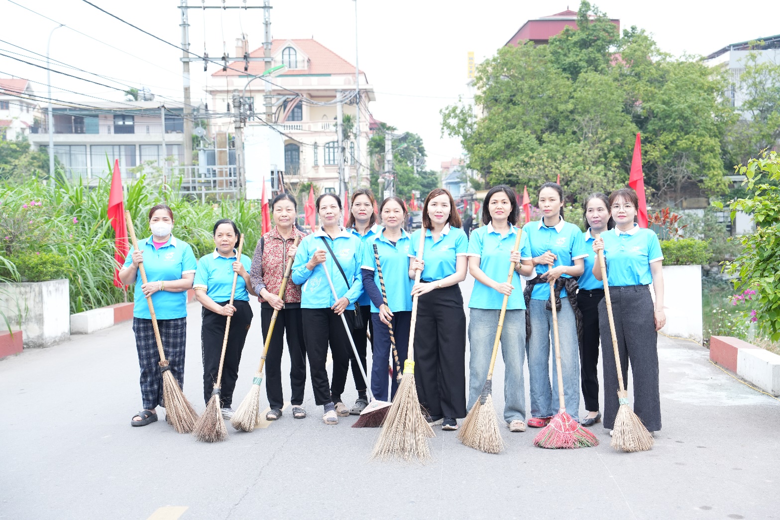 A group of women holding brooms  AI-generated content may be incorrect.
