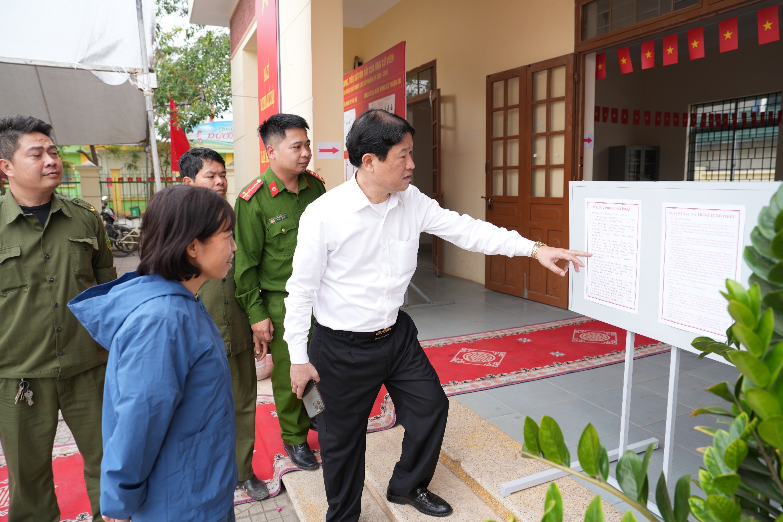 A person pointing at a white board  AI-generated content may be incorrect.