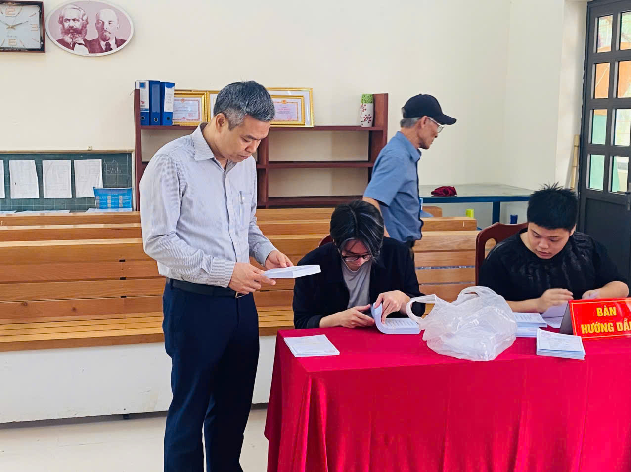 A group of people sitting at a table  AI-generated content may be incorrect.