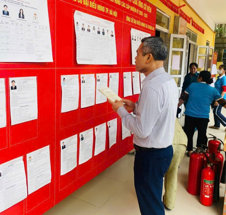 A person looking at a board with papers on it  AI-generated content may be incorrect.