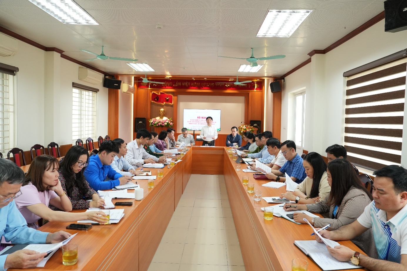 A group of people sitting at a table  AI-generated content may be incorrect.