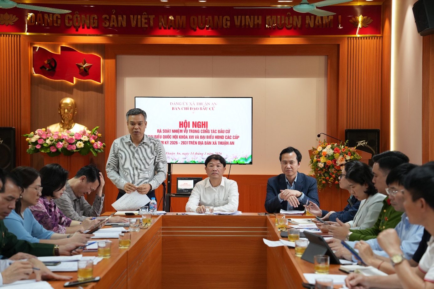 A group of people sitting at a table  AI-generated content may be incorrect.