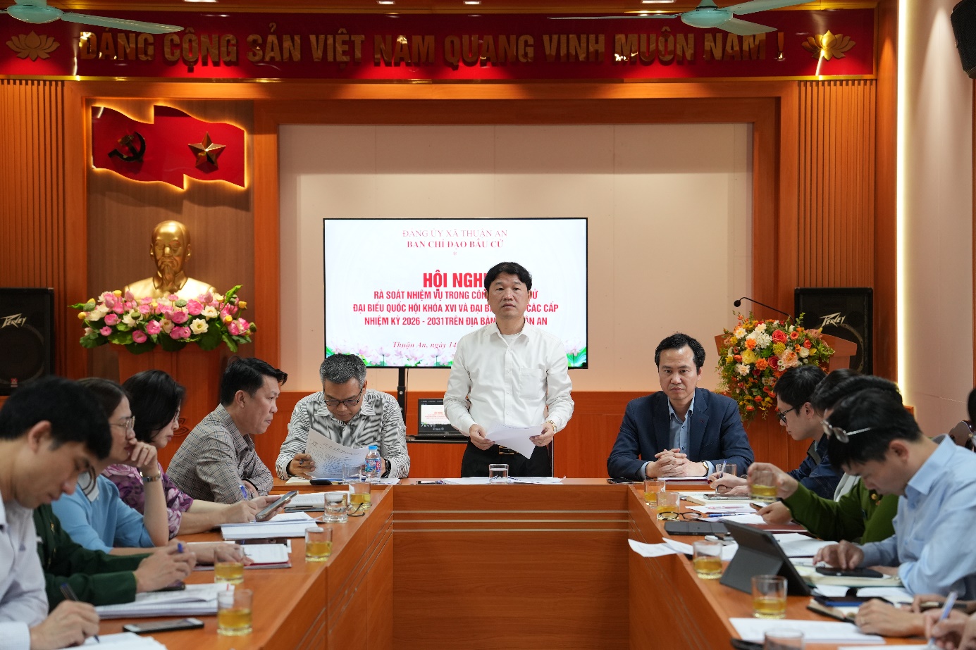 A group of people sitting at a table  AI-generated content may be incorrect.