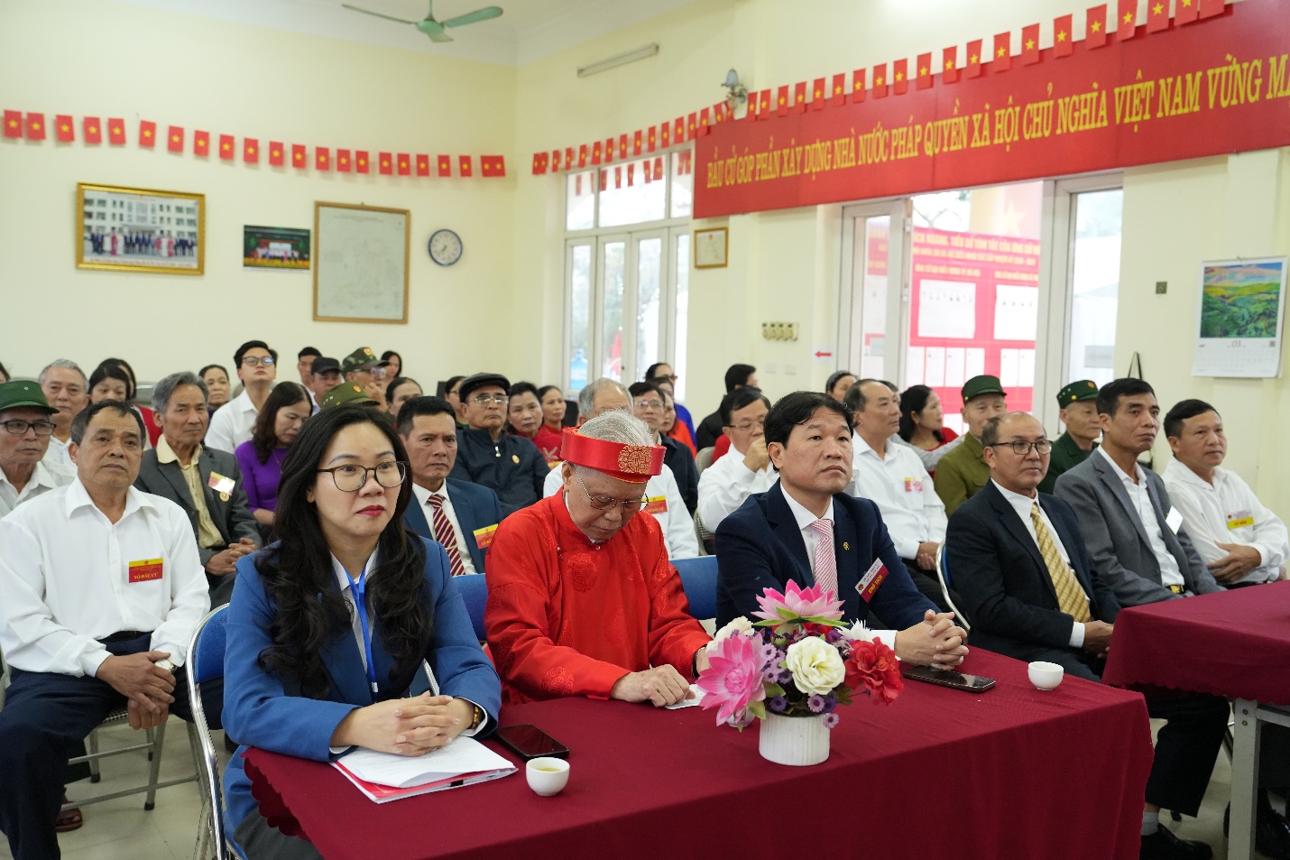 A group of people sitting at a table  AI-generated content may be incorrect.