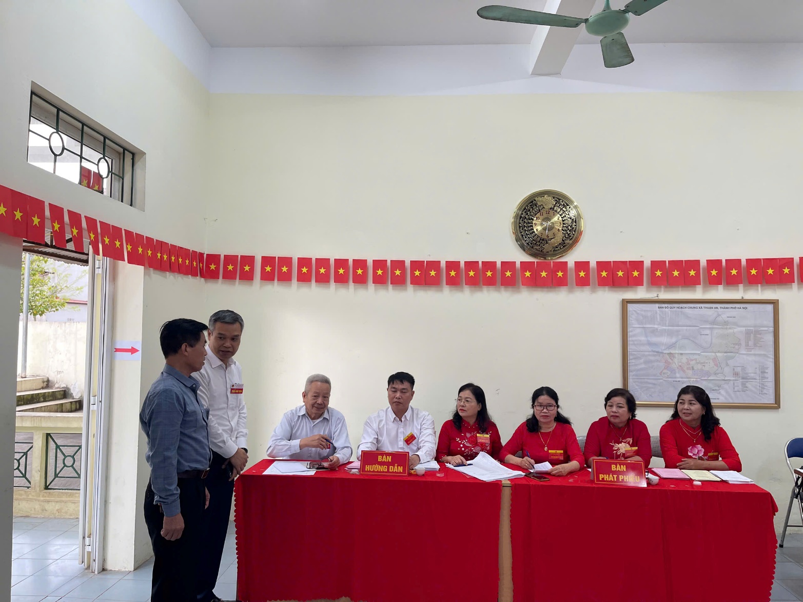 A group of people sitting at a table  AI-generated content may be incorrect.