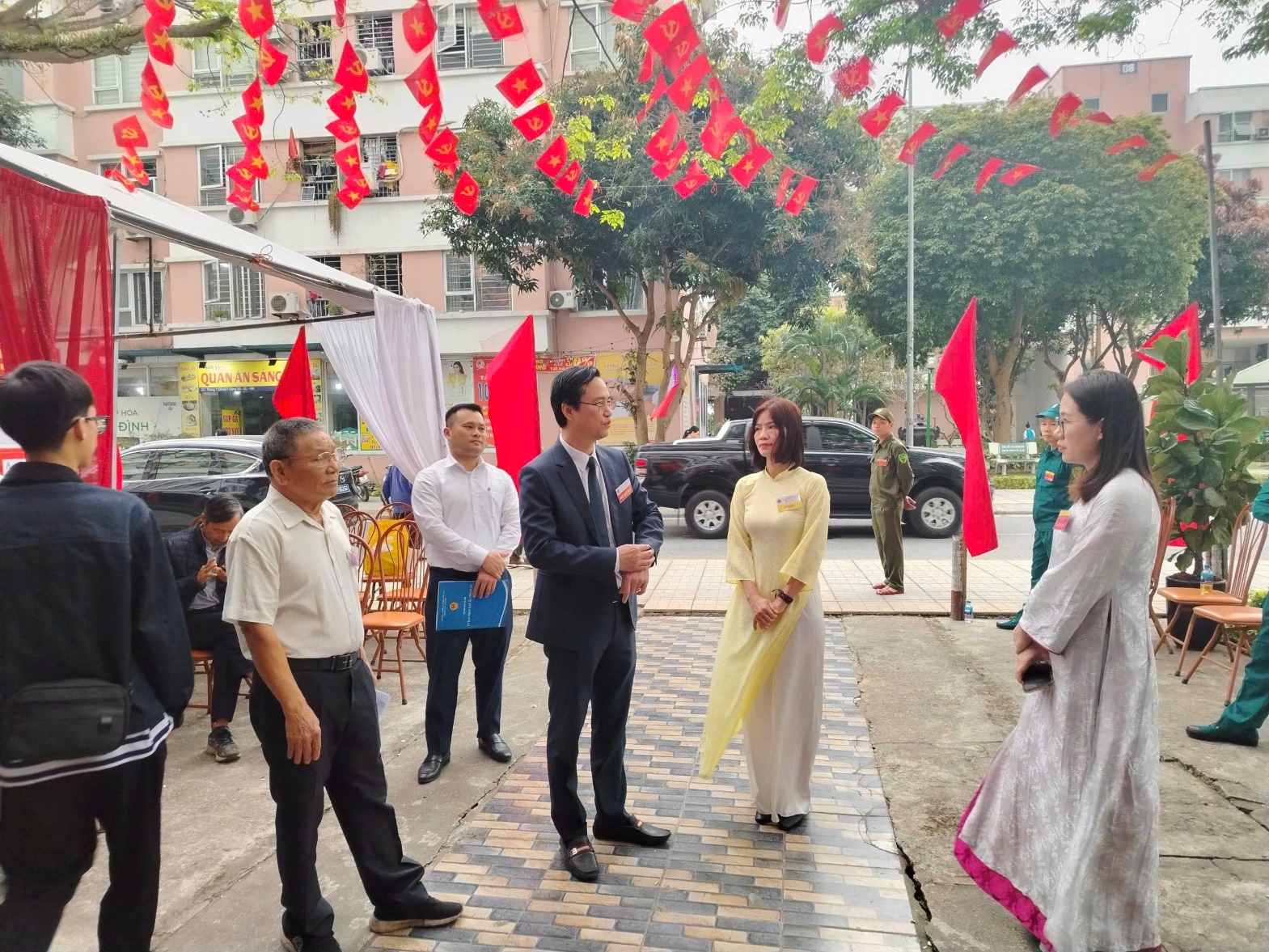 A group of people standing outside  AI-generated content may be incorrect.