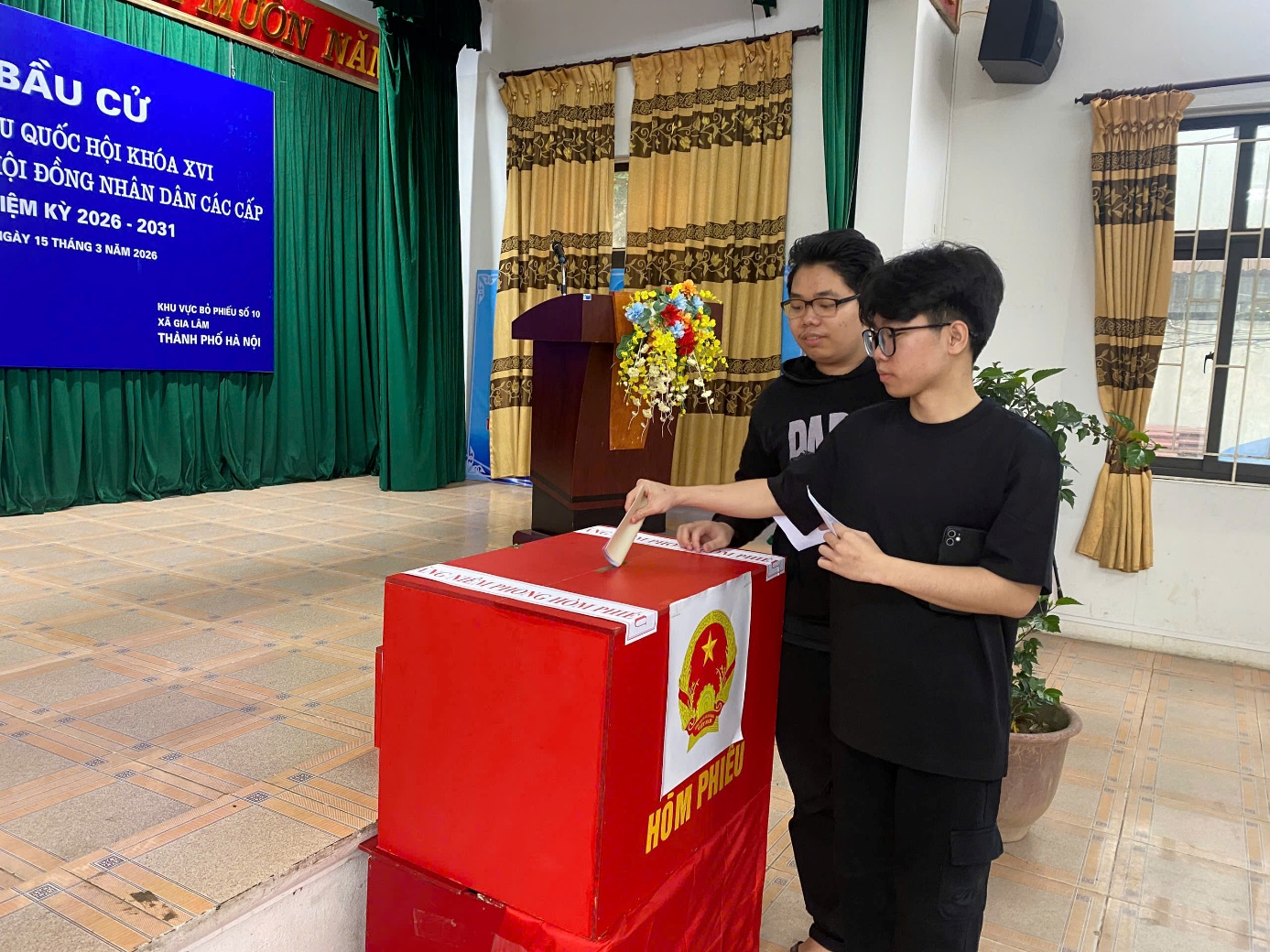 A person putting a paper in a box  AI-generated content may be incorrect.