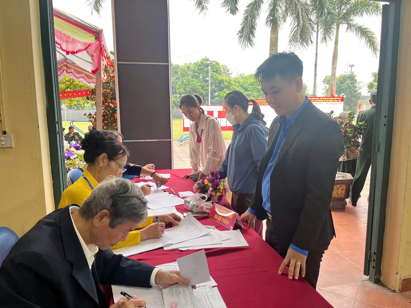 A group of people signing papers  AI-generated content may be incorrect.