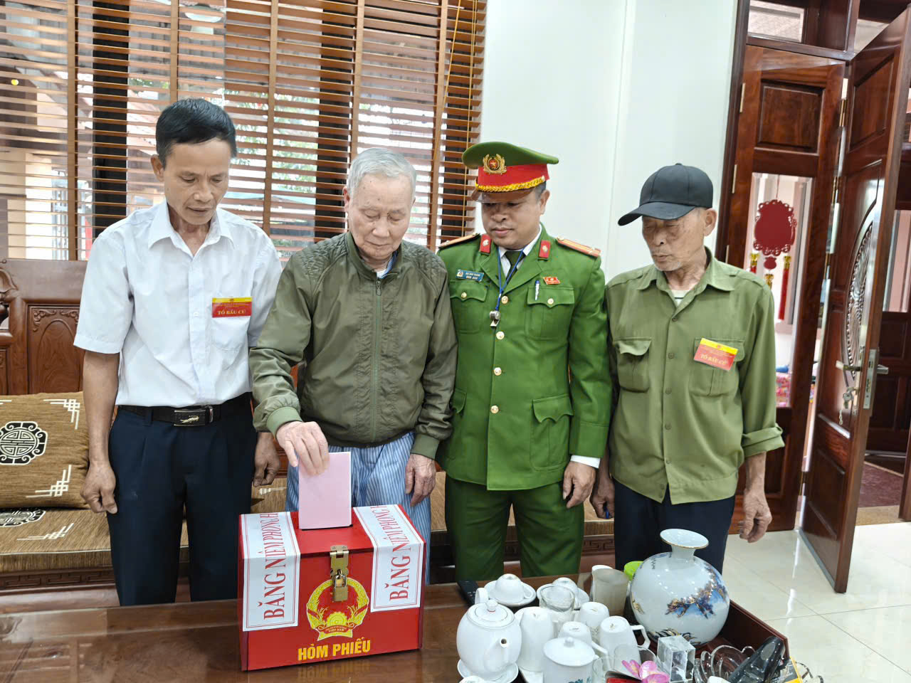 A group of men in military uniforms putting a ballot in a box  AI-generated content may be incorrect.