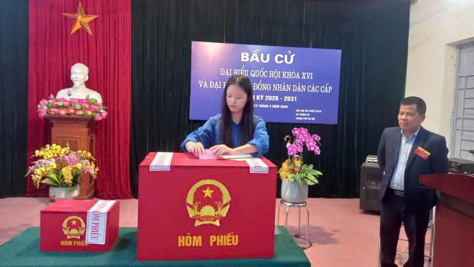 A person sitting at a red box  AI-generated content may be incorrect.