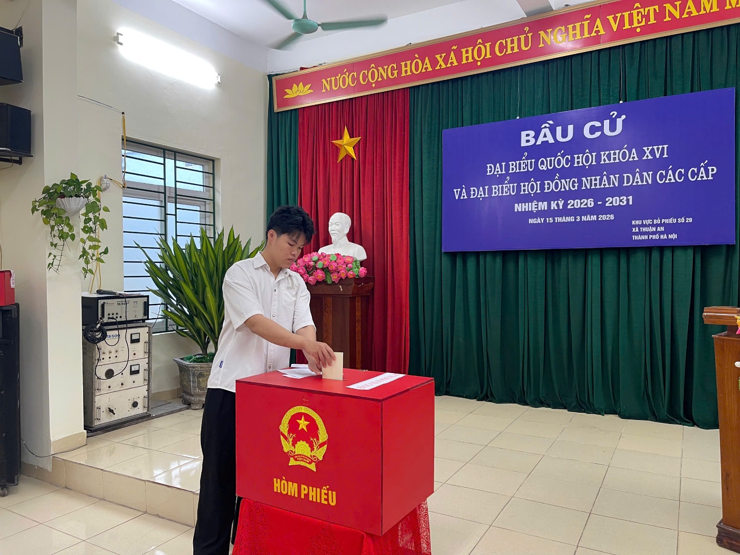 A person putting a ballot into a box  AI-generated content may be incorrect.