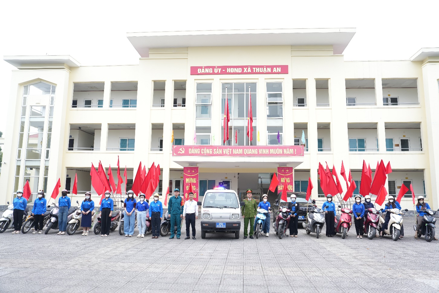 A group of people standing in front of a building  AI-generated content may be incorrect.