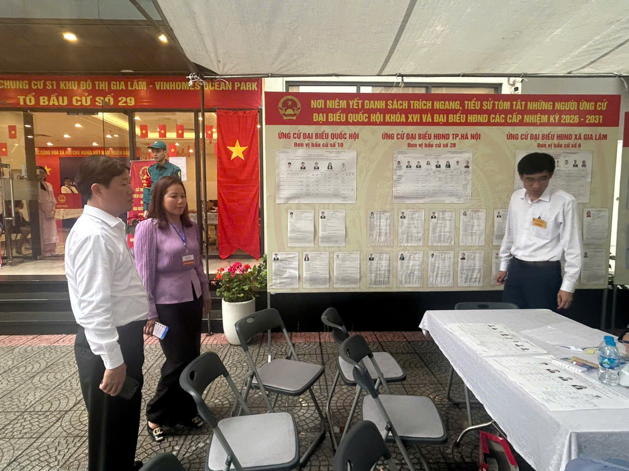 A group of people standing in front of a board  AI-generated content may be incorrect.