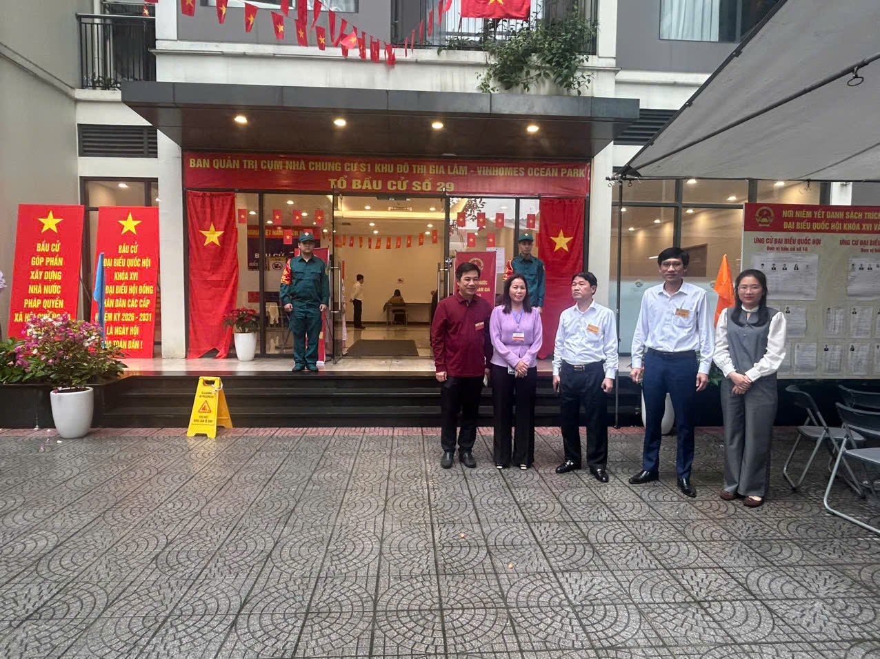 A group of people standing in front of a building  AI-generated content may be incorrect.