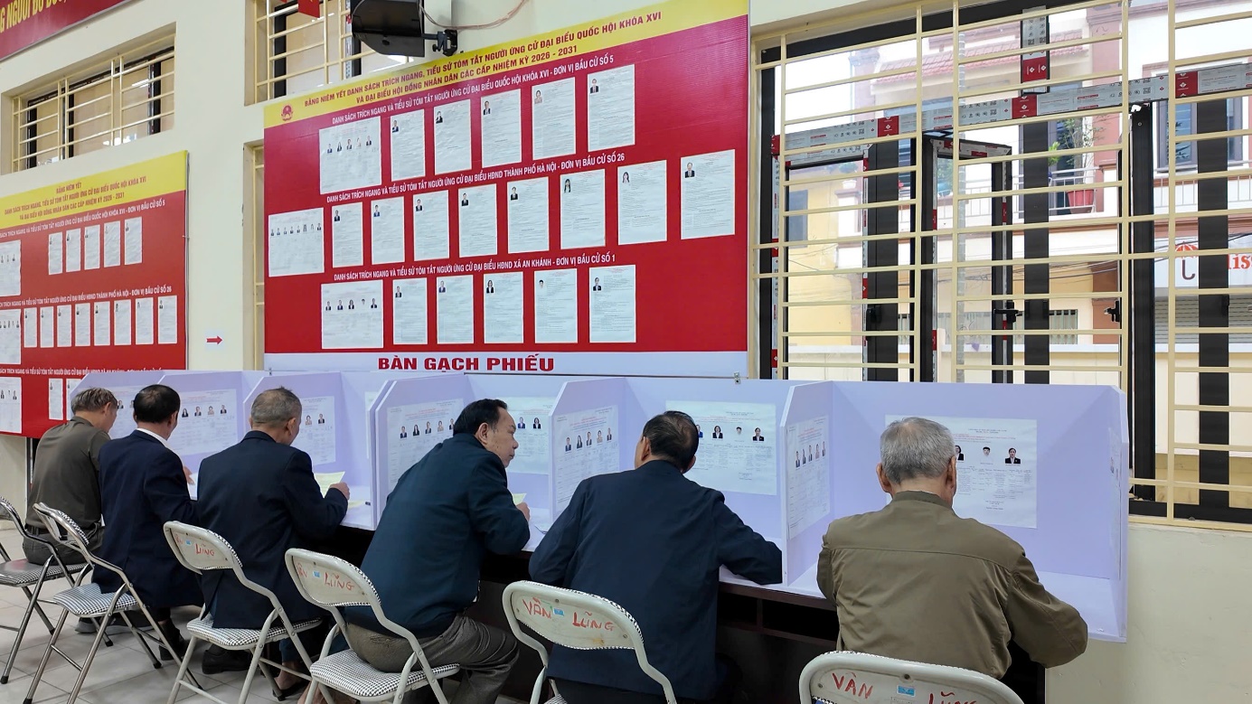 A group of people sitting at a table  AI-generated content may be incorrect.