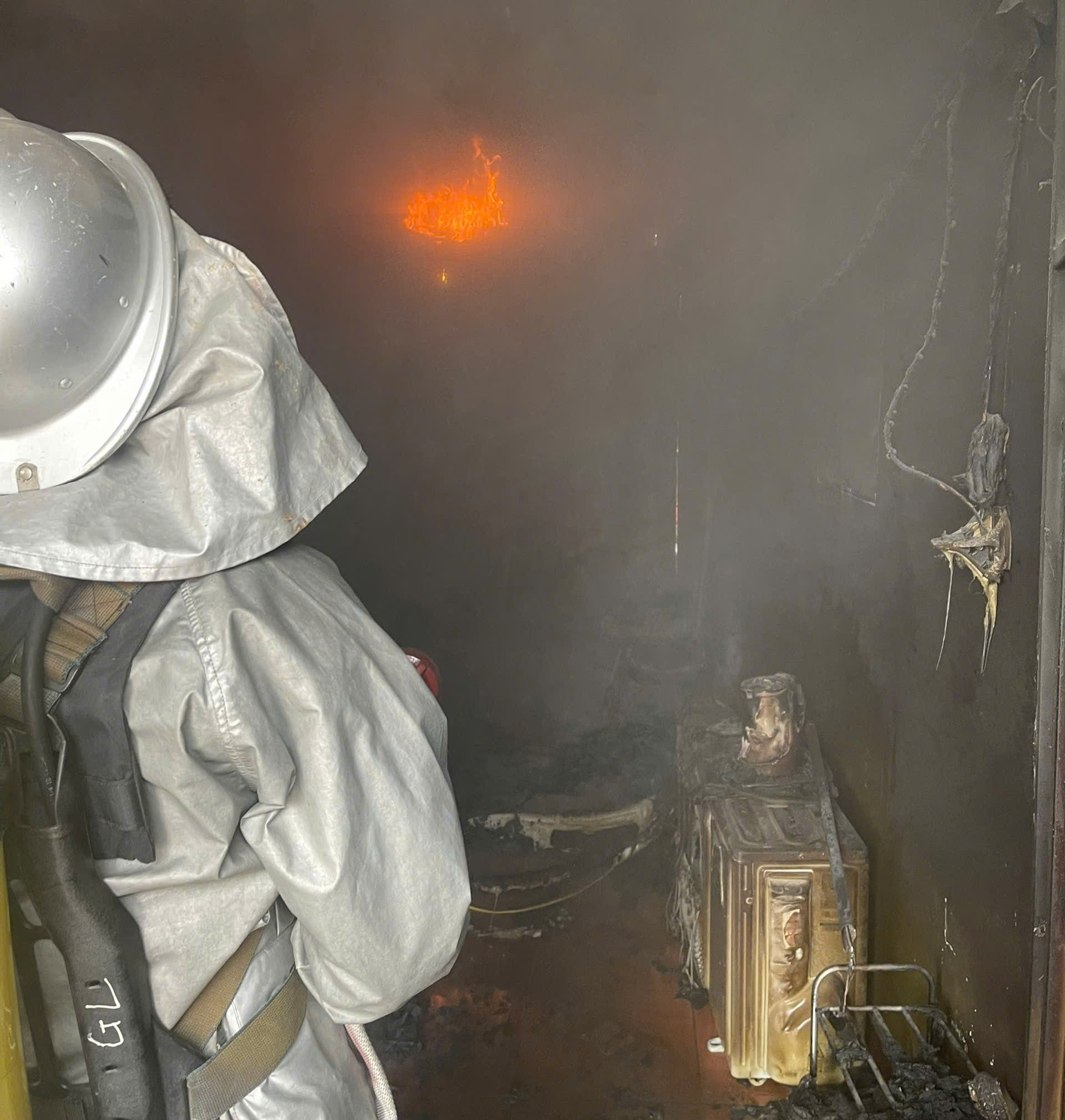 A firefighter in a room with smoke  AI-generated content may be incorrect.