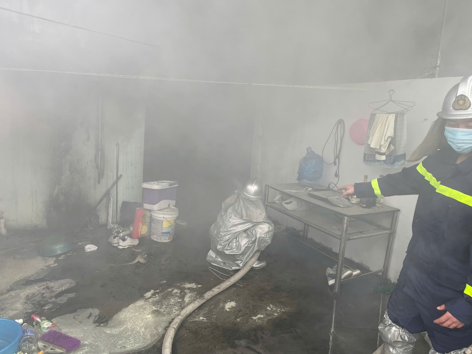 A firefighter standing in a room with smoke  AI-generated content may be incorrect.