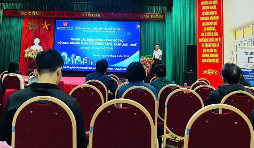 A group of people sitting in chairs in front of a screen  AI-generated content may be incorrect.