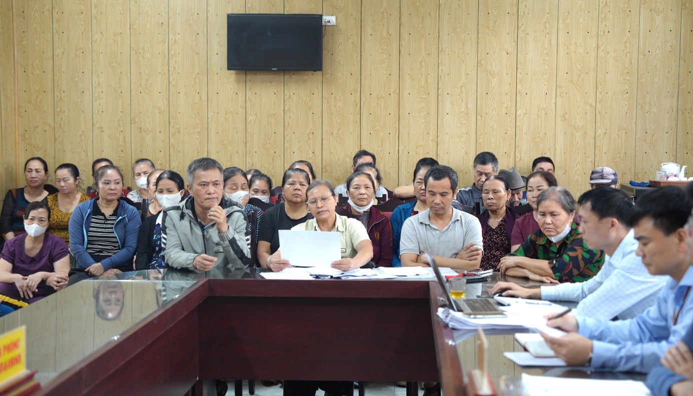 A group of people sitting at a table  AI-generated content may be incorrect.