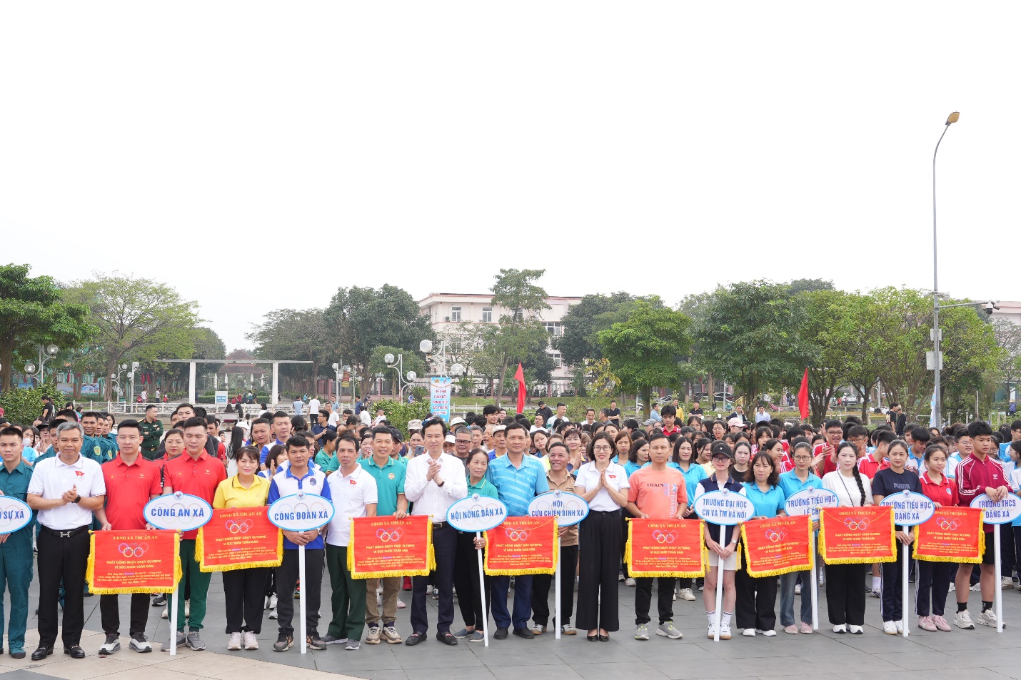 A group of people holding signs  AI-generated content may be incorrect.