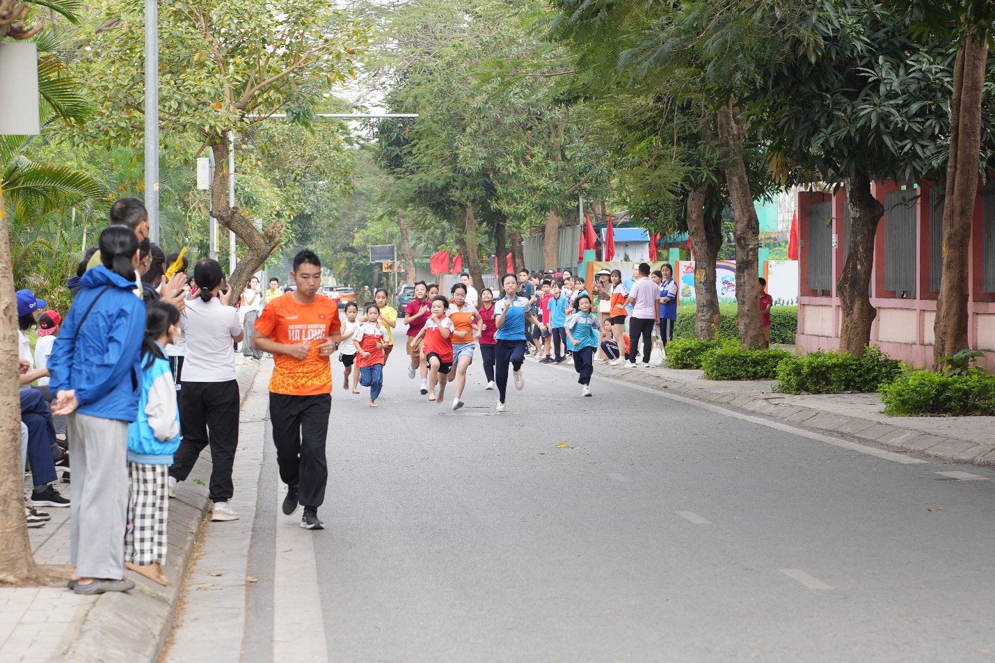 A group of people running on a street  AI-generated content may be incorrect.