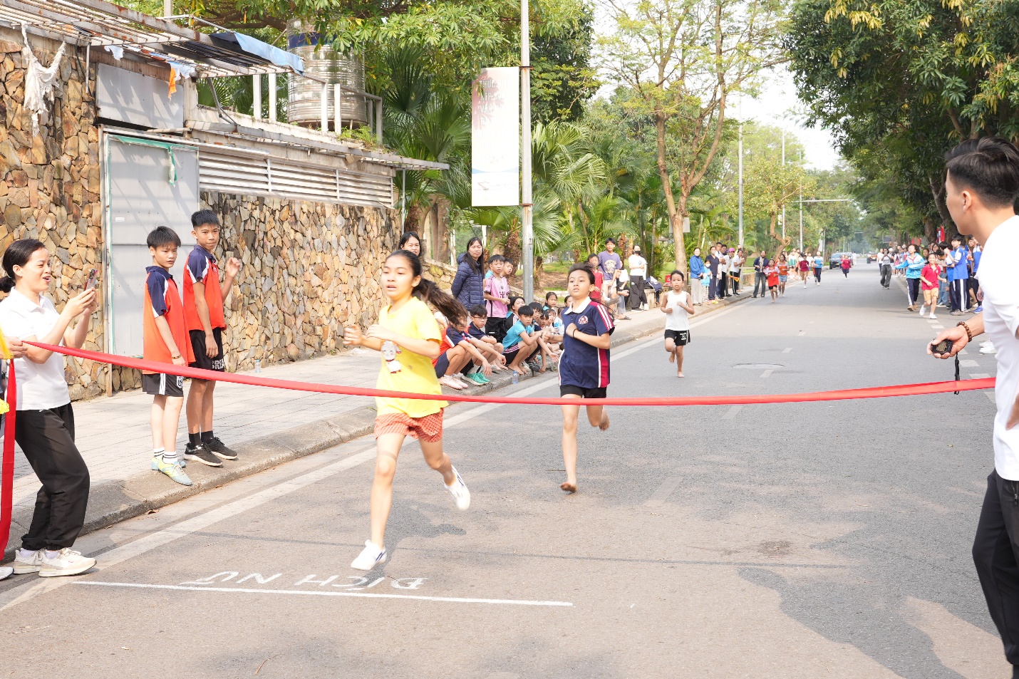 A group of people running on a street  AI-generated content may be incorrect.