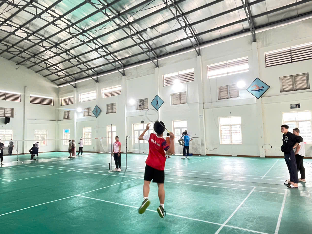 A person in a sports hall  AI-generated content may be incorrect.