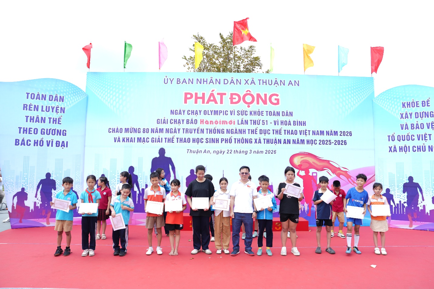 A group of people standing on a red carpet  AI-generated content may be incorrect.