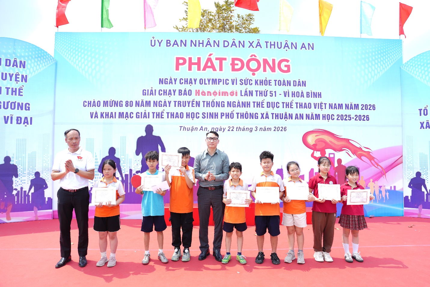 A group of people holding signs  AI-generated content may be incorrect.