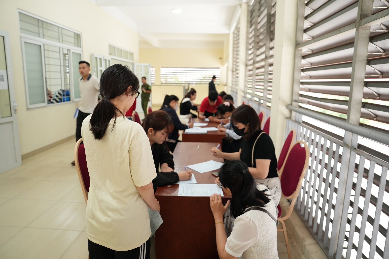 A group of people in a room  AI-generated content may be incorrect.