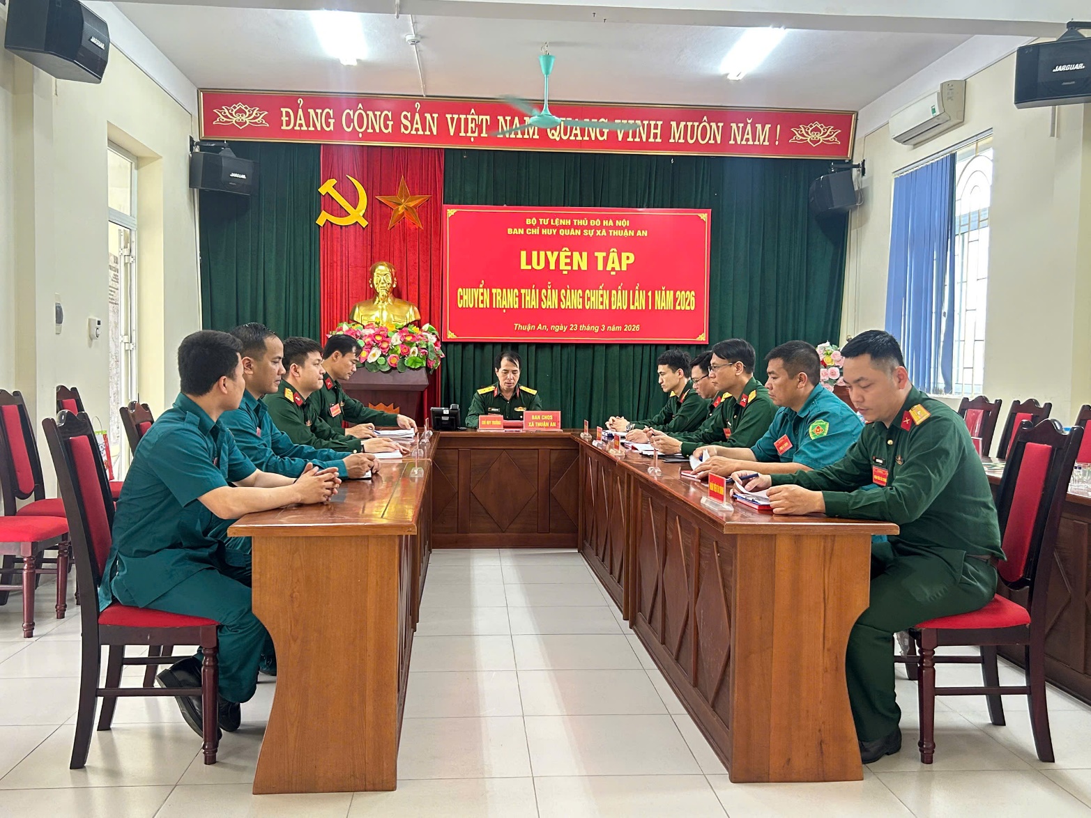 A group of people sitting at a table  AI-generated content may be incorrect.