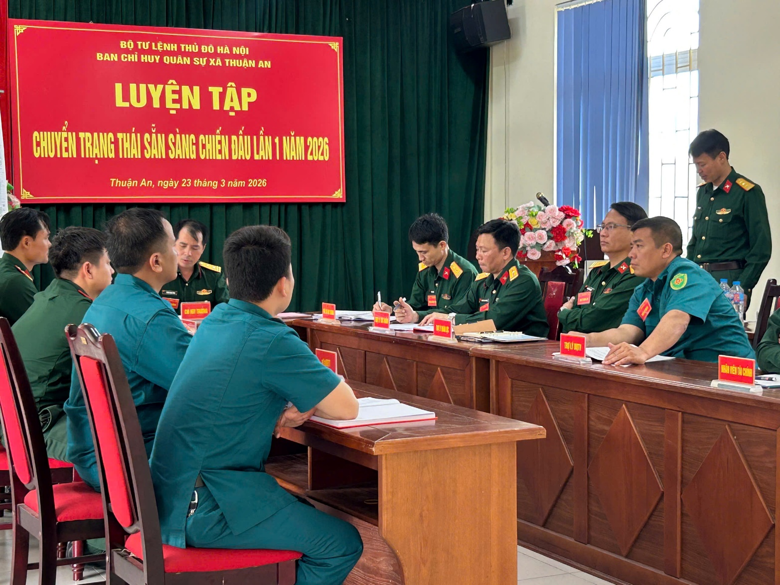 A group of people in uniform sitting at a table  AI-generated content may be incorrect.