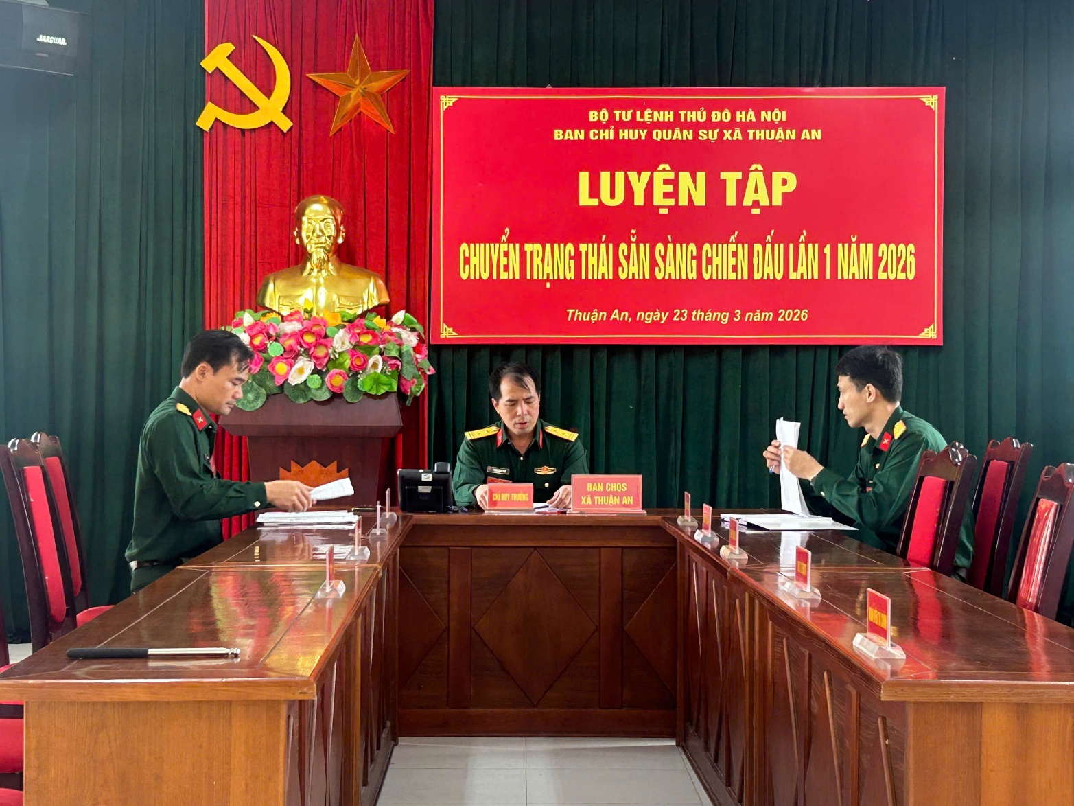 A group of men in military uniforms sitting at a desk  AI-generated content may be incorrect.