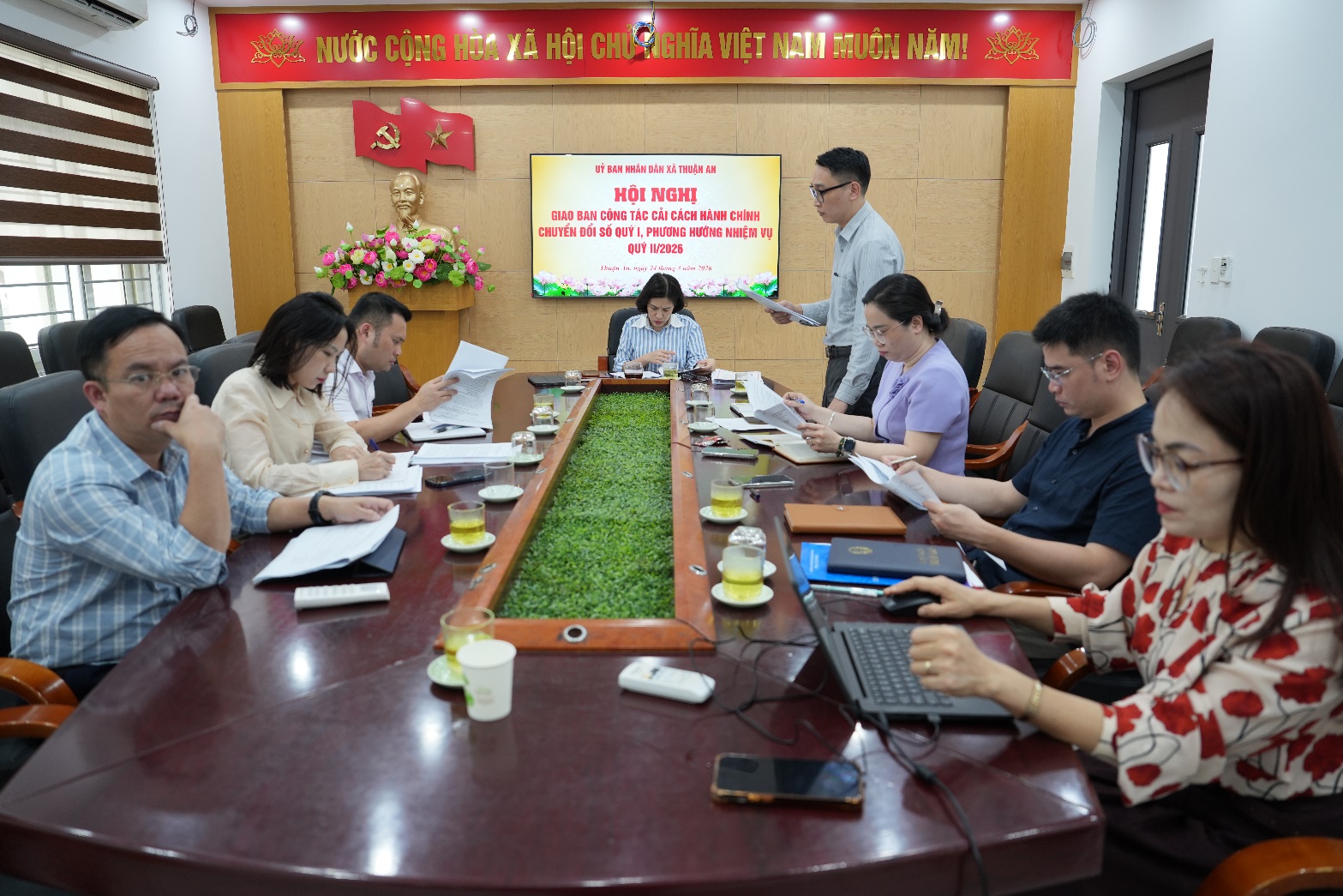 A group of people sitting around a table  AI-generated content may be incorrect.