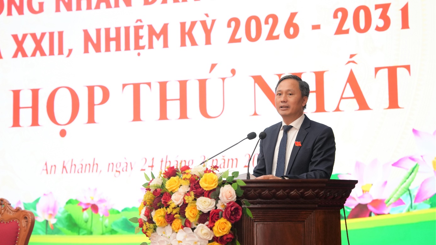 A person standing at a podium with a bunch of flowers  AI-generated content may be incorrect.